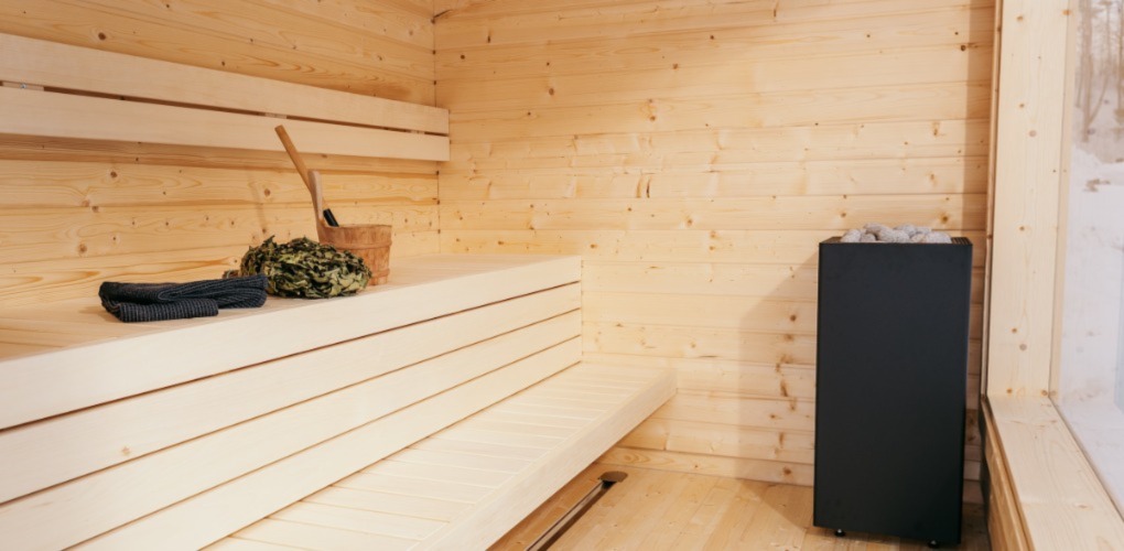 photo of sauna with light wood and benches