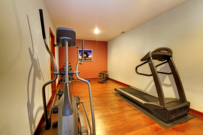 Remodeled finished basement with home gym.